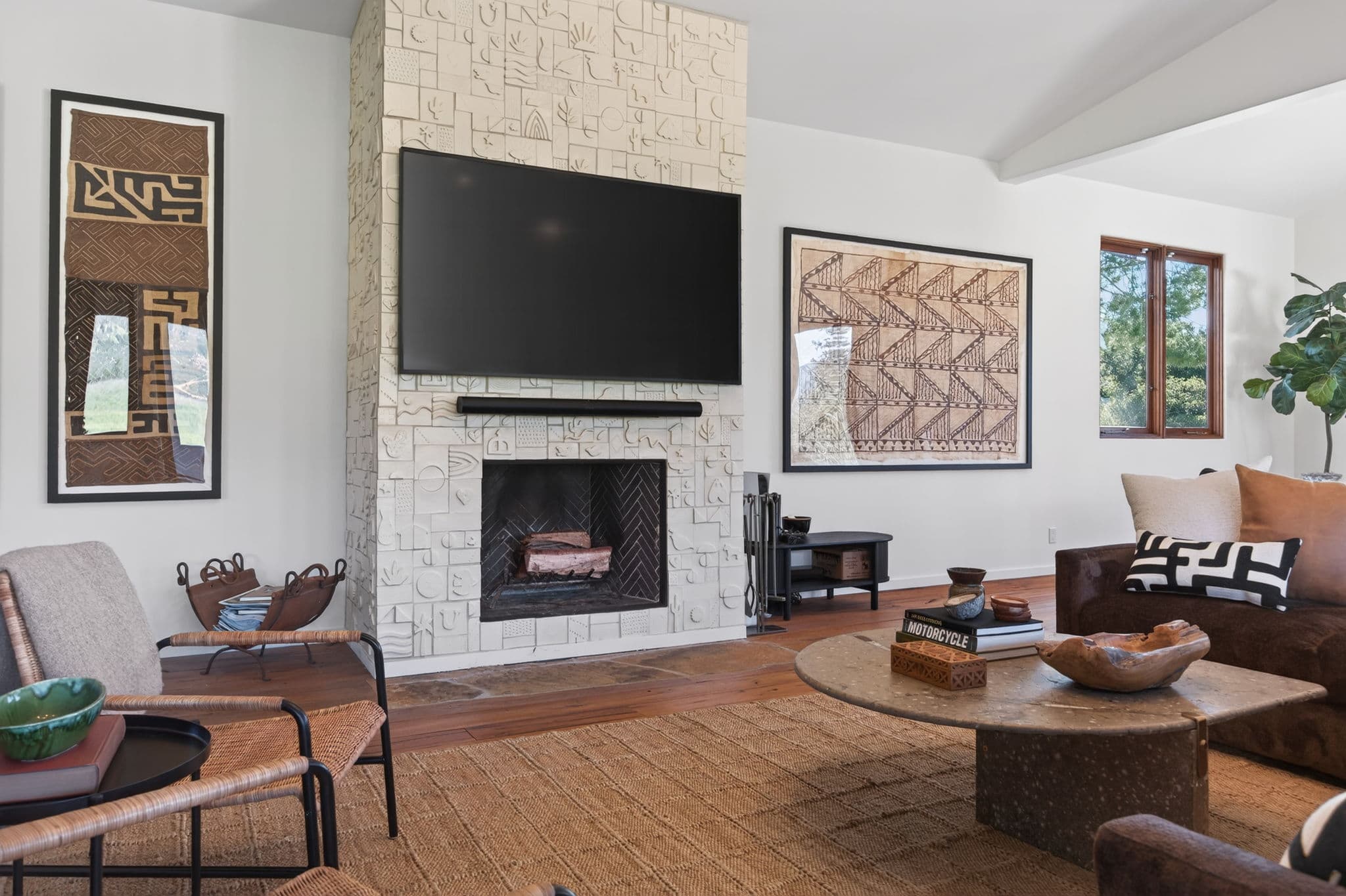 Living room with fireplace and abundant natural light