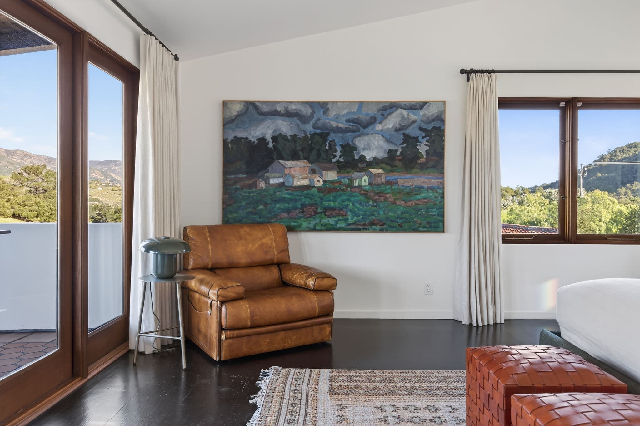 Primary Suite — king bedroom with warm textures and natural light